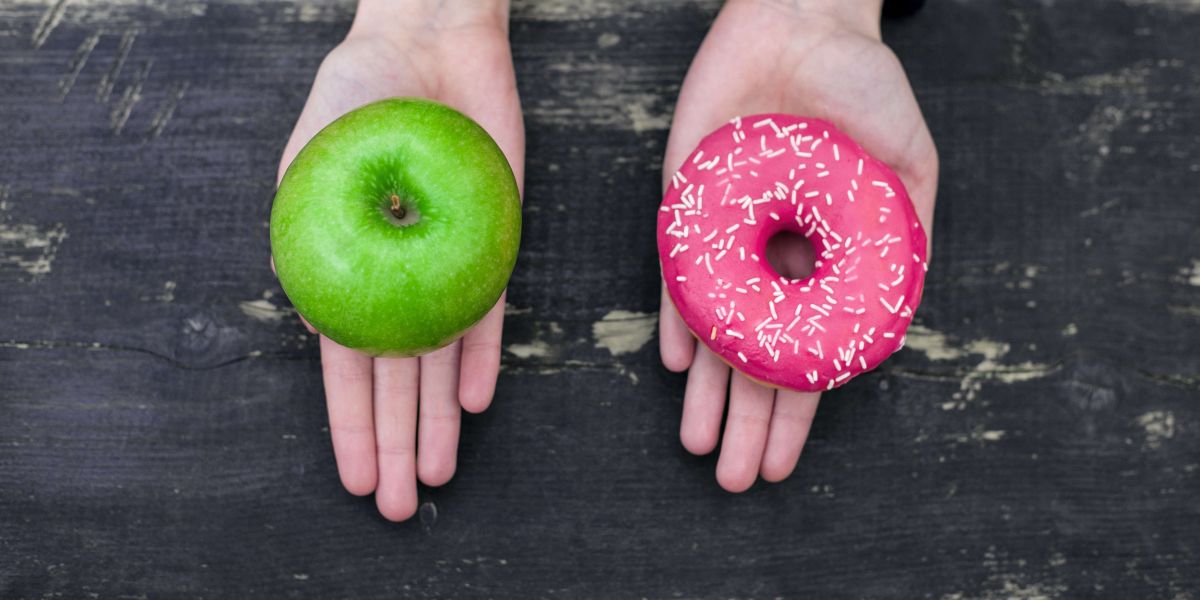 choosing between an apple and a donut